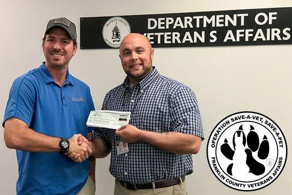 Pictured (left to right): Jonathan Berkley of Keystone RV Center and Department of Veterans Affairs Director Justin Slep. 