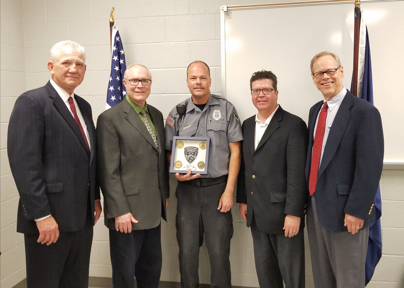 Pictured above, left to right: Former County Administrator John Hart, Commissioner Bob Thomas, Correctional Officer of the Year Robert Fink, Commissioner Chairman Dave Keller, Commissioner Bob Ziobrowski