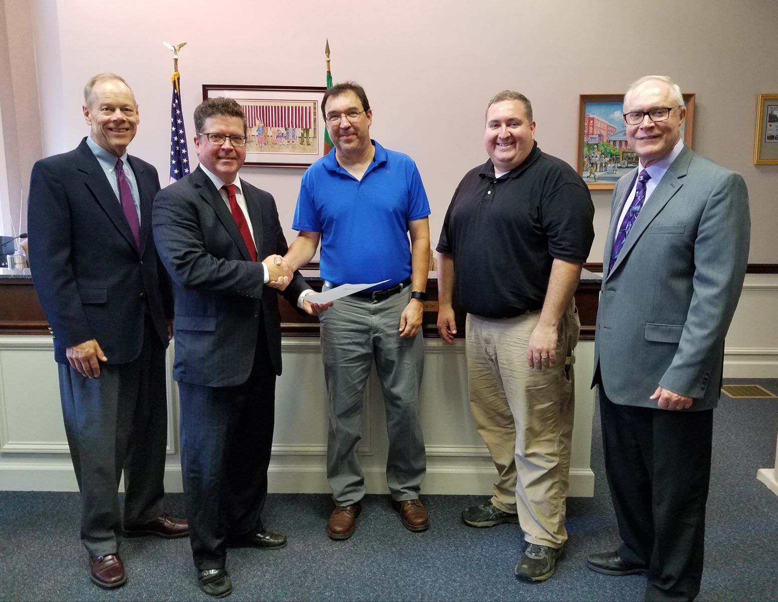 Pictured above (left to right): Commissioner Bob Ziobrowski, Commissioner Chairman Dave Keller, CVRTC President Garret Stahlman, CVRTC volunteer Jim Stanton, and Commissioner Bob Thomas.  The commissioners present CVRTC with a copy of the signed resolution authorizing the donation of the rail car.