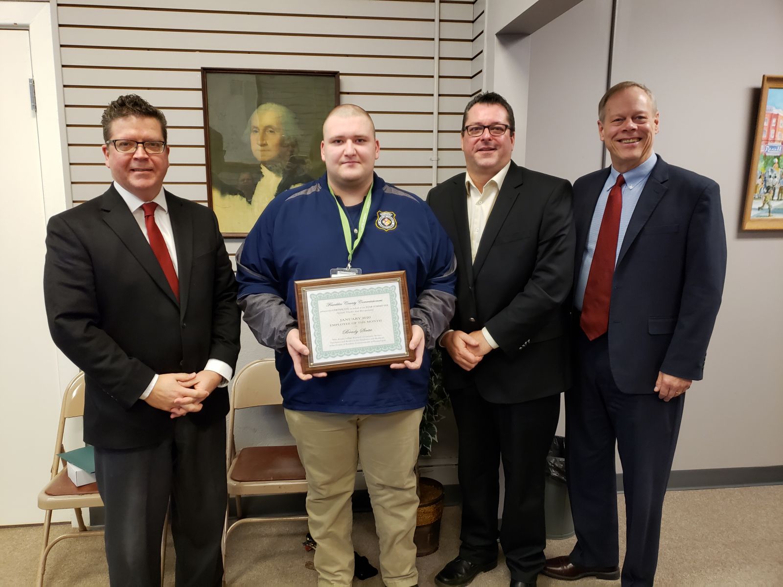 Pictured (left to right): Commissioner Chairman Dave Keller, Telecommunicator Brady Strite, Commissioner John Flannery, Commissioner Bob Ziobrowski