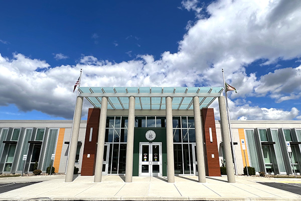 The county administration building exterior against a blue sky.