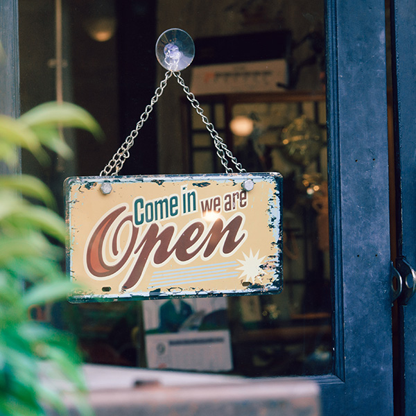 Open signboard on shop door