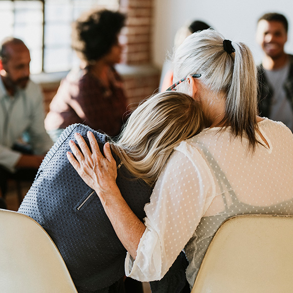 People support each other in a rehab session