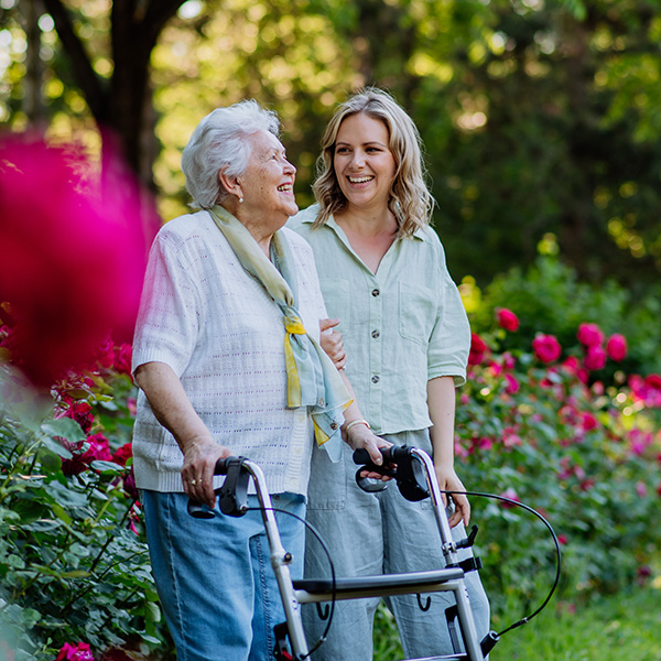 An adult granddaguhter supporting her senior grandmother