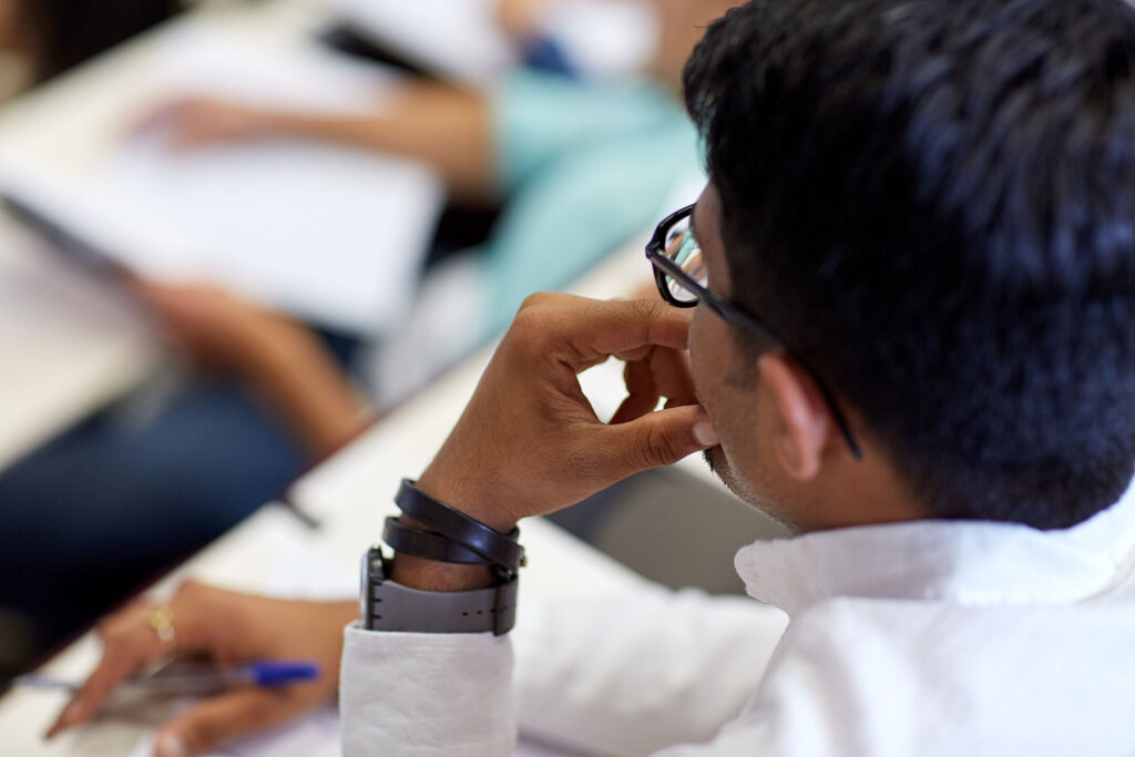 youth sitting in class and paying attention