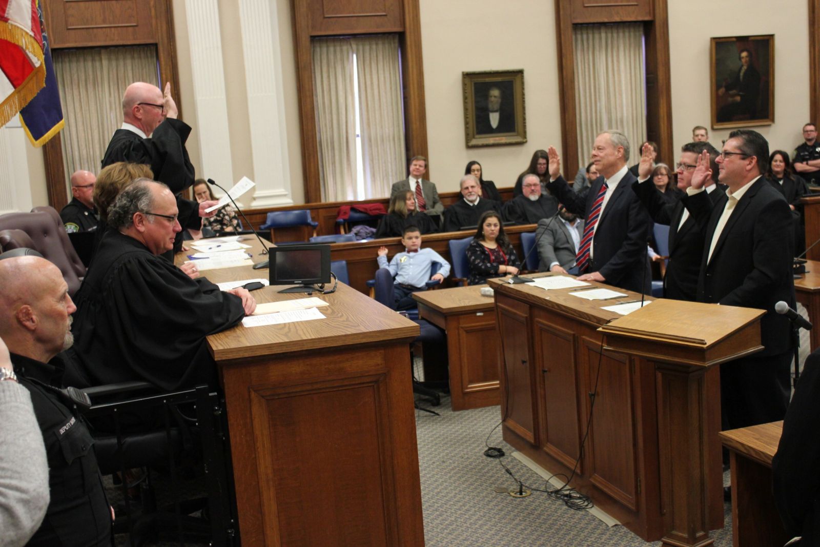 President Judge Meyers administers oath to Franklin County Commissioners (left to right) Bob Ziobrowski, Dave Keller, and John Flannery.