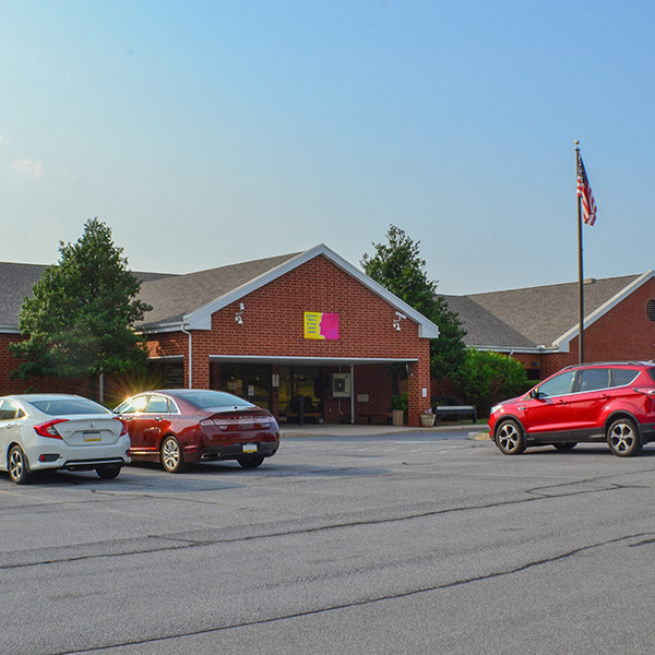 exterior of the Human Services Administration Building and parking lot