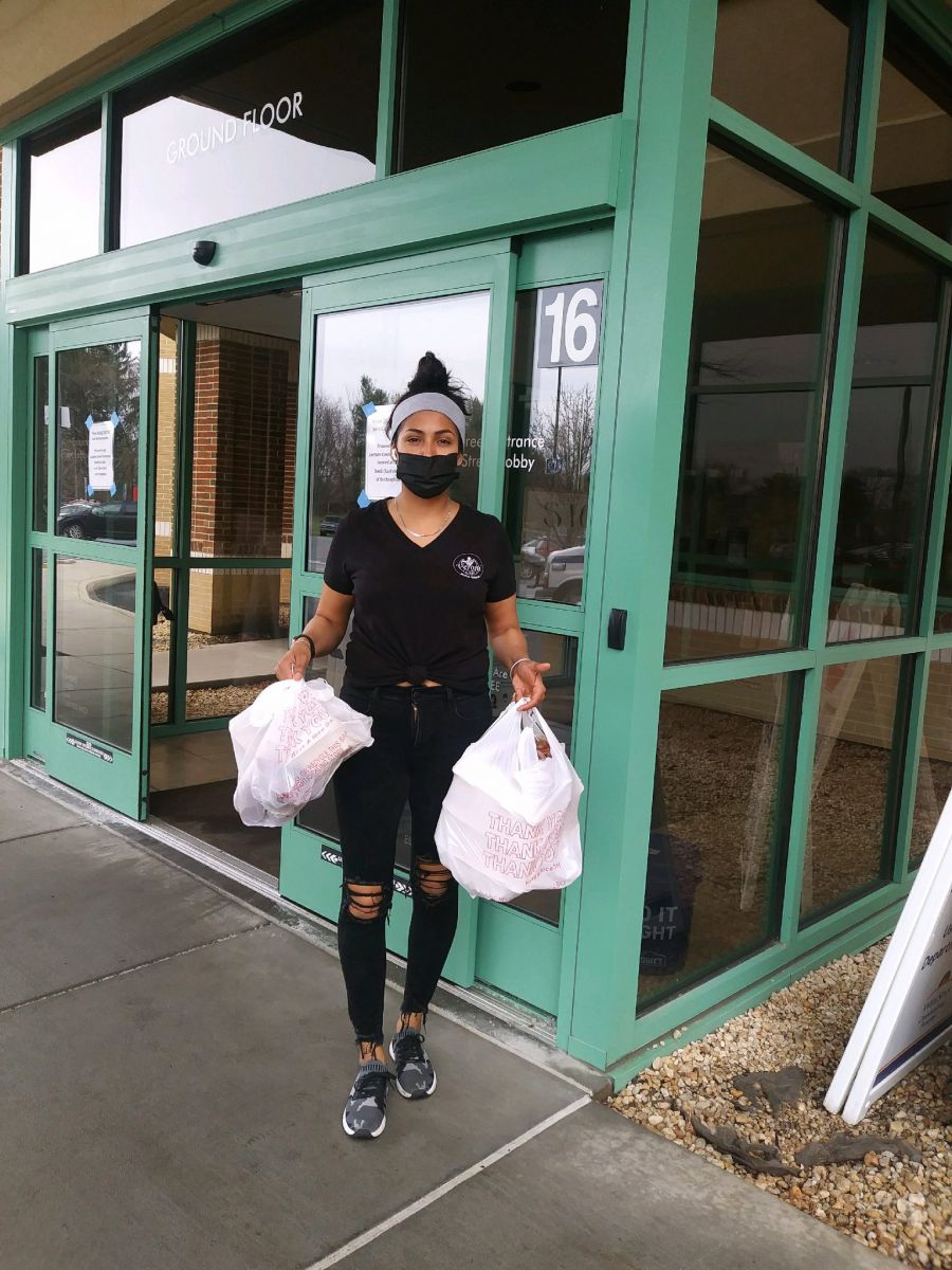 Above: Monica Mata of Veroni Cafe drops off meals donated by Franklin County employees to health care workers at Chambersburg Hospital.  Photo by: Sharon Berbert