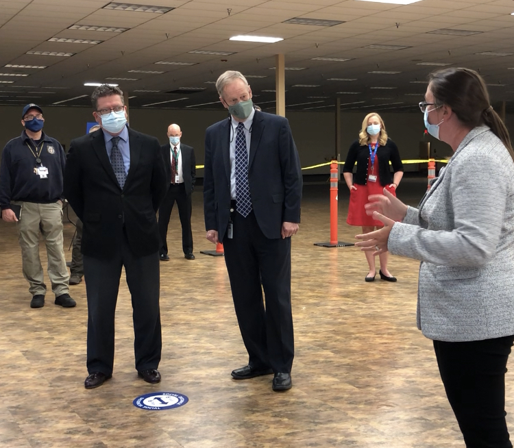 Franklin County Commissioner Chairman Dave Keller and Commissioner Bob Ziobrowski listen as Casey McDermitt, WellSpan Regional Lead, discusses the clinic’s operational flow.