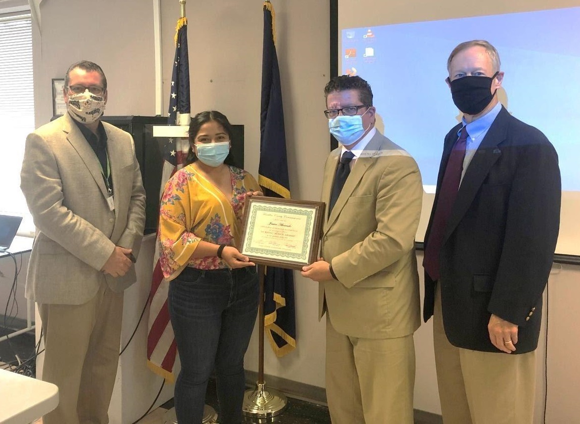 Photo (left to right): Commissioner John Flannery, awardee Jessica Alvarado, Commissioner Chairman Dave Keller, Commissioner Bob Ziobrowski     