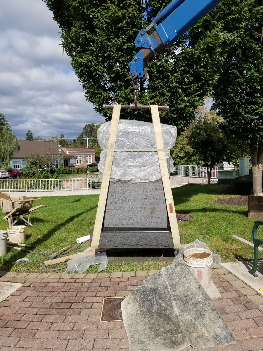 The memorial site is prepared and the monument is ready to be placed in Fort Chambers Park.