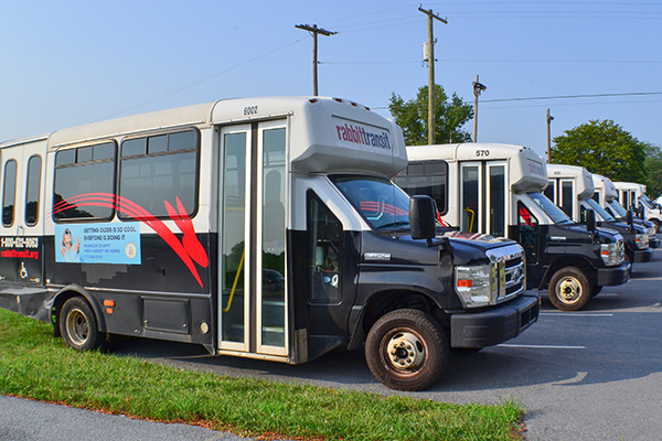 Franklin County buses in a bus yard.