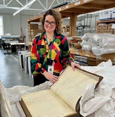 Stefanie Basalik, Franklin County Archives & Records Management Director with a huge old book